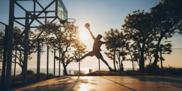 black man doing sports, playing basketball on sunrise, jumping silhouette